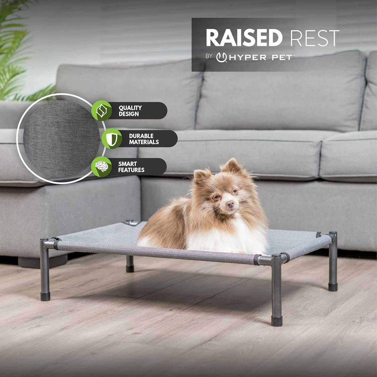 Raised Rest Deluxe elevated dog bed in grey breathable 600 Denier Oxford fabric with sturdy anti-rust powder coated frame and small dog lying on it