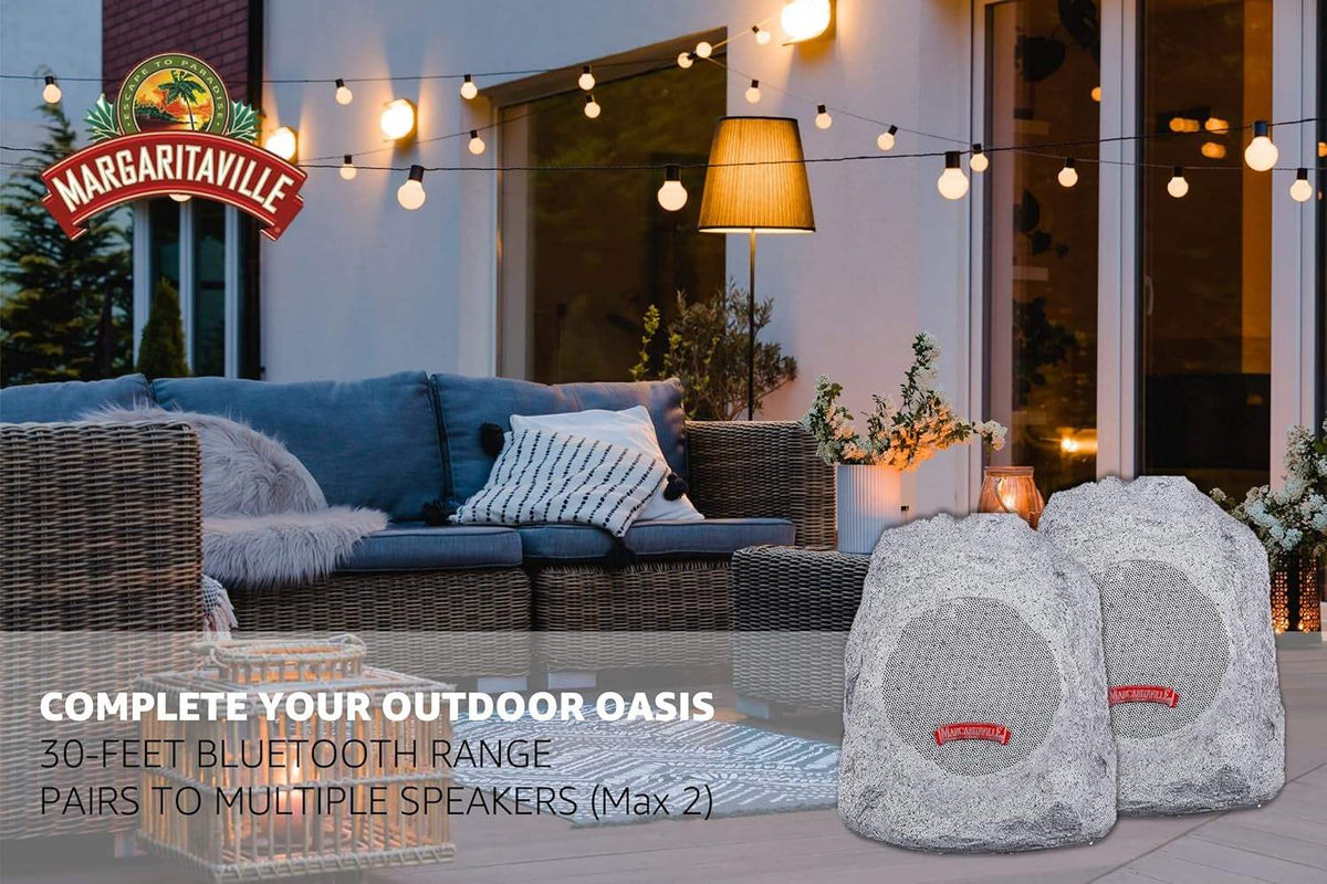 Outdoor Rock Bluetooth speakers in granite grey with rock-like texture, durable waterproof design for patio or yard use