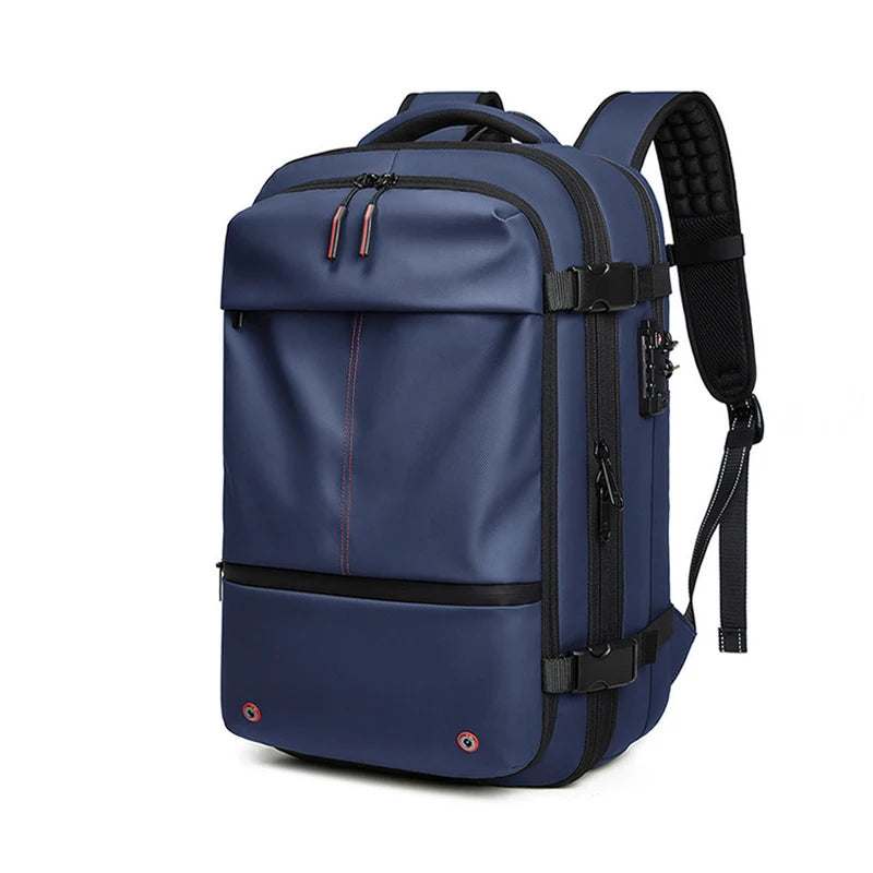 Travel Backpack Vacuum in navy blue waterproof fabric with multiple compartments, padded shoulder straps, and side compression straps.