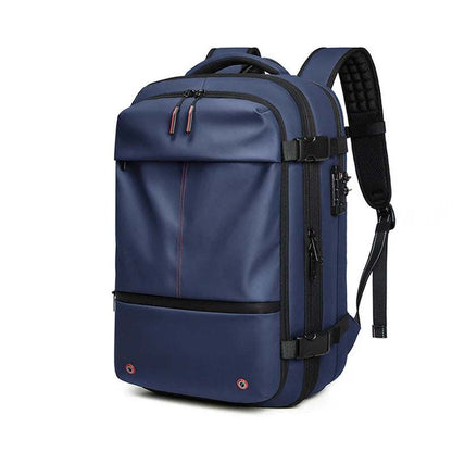 Travel Backpack Vacuum in navy blue waterproof fabric with multiple compartments, padded shoulder straps, and side compression straps.