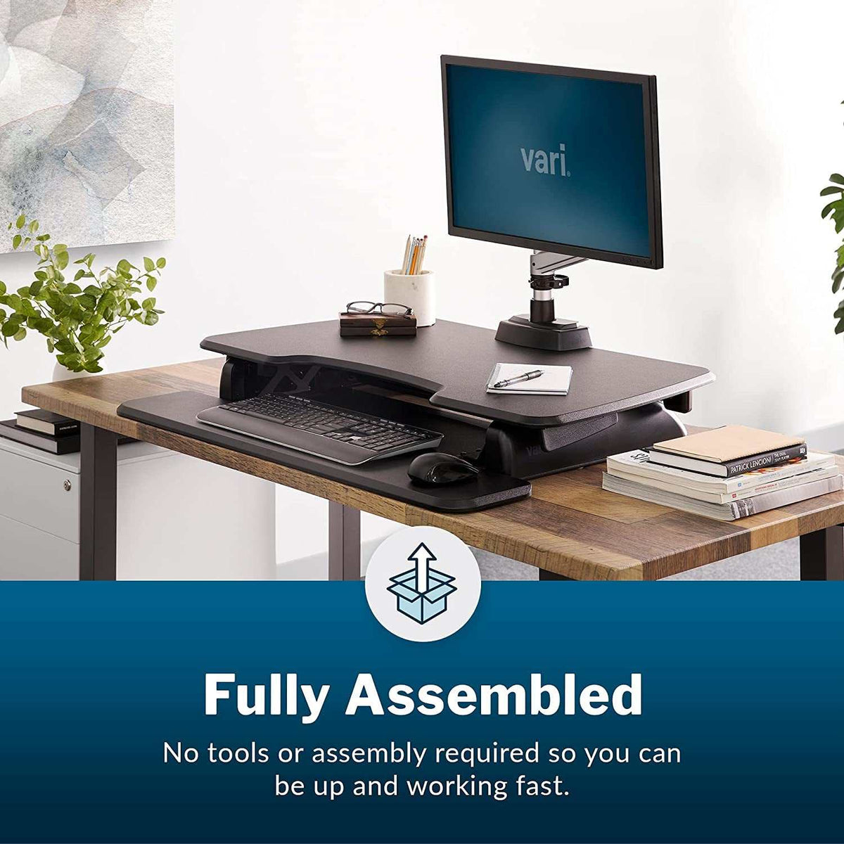 Two-Tier Standing Desk with black finish, dual-handle spring-assisted lift, adjustable height, upper monitor platform and lower keyboard tray.