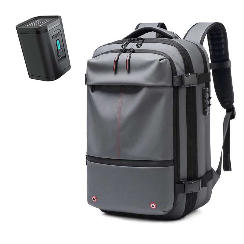 Gray waterproof fabric Travel Backpack Vacuum with black straps, compression buckles, and padded shoulder straps, plus a compact black vacuum pump.