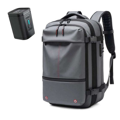 Gray waterproof fabric Travel Backpack Vacuum with black straps, compression buckles, and padded shoulder straps, plus a compact black vacuum pump.