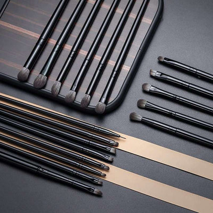 Makeup Brushes Set featuring black synthetic hair bristles with sleek black handles in varied small to medium brush heads for detailed application.