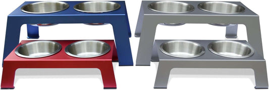 Elevated Dog Bowls in metallic red, blue, and gray anodized aluminum with raised stainless steel insert bowls and anti-slip feet.