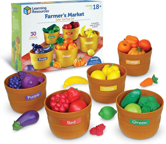 Farmer's Market color sorting set with labeled brown baskets holding vibrant red, orange, yellow, green, and purple realistic plastic fruits and vegetables.