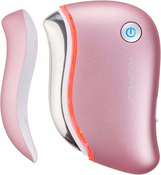 Heated Gua Sha Tool in metallic pink with contoured smooth edges, power button, and LED light feature for facial massage