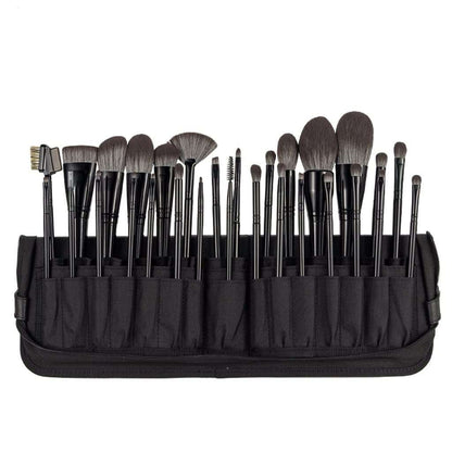 Makeup Brushes Set with black synthetic hair bristles and black handles, arranged in a black fabric roll-up case.