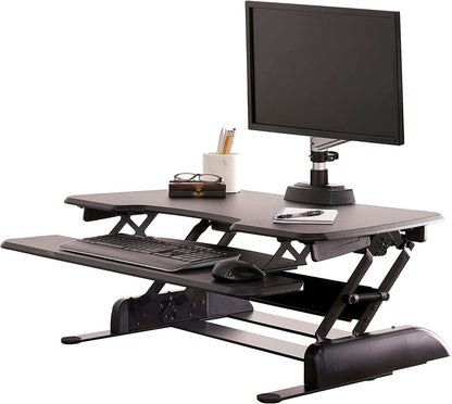 Two-Tier Standing Desk converter in black with adjustable height, dual-handle lift, and separate keyboard tray for ergonomic workspace.
