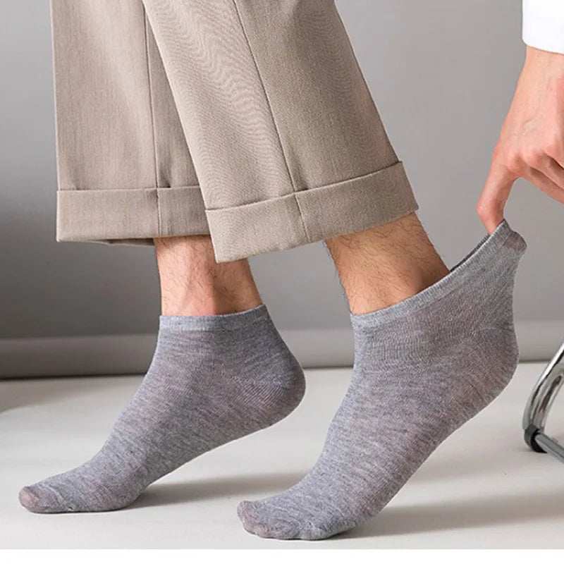 Grey cotton blend invisible low-cut Women/Men Boat Socks with elastic ankle cuff worn by a person