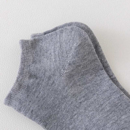 Pair of grey Women/Men Boat Socks made from breathable fabric with a no-show low cut design and reinforced toe