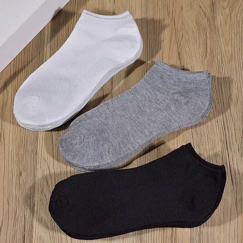 Women/Men Boat Socks in white, grey, and black low cut ankle style made of breathable material with non-slip silicone soles